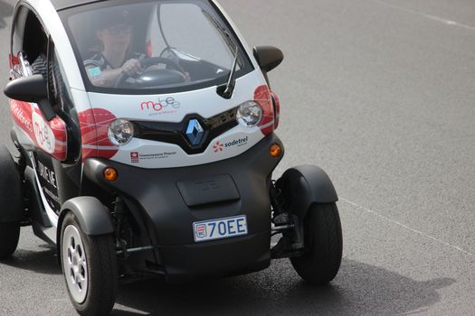 Monte-Carlo, Monaco - April 6, 2016: Electric Car Renault Twizy on Avenue d'Ostende in Monaco. Woman Driving an Electric Car Sharing Vehicles (Mobee) in the south of France