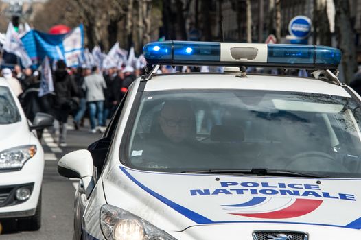 FRANCE, Paris : Police officers wave union flags as they take part in a protest called by the Unite-police SGP-FO police officers' union in Paris on April 7, 2016.A few thousand police officers, 8,000 according to organizers and 2,000 according to other police sources, demonstrated in Paris to demand the increase of a risk premium, in the wake of recent attacks and the state of emergency that is wearing out forces. 