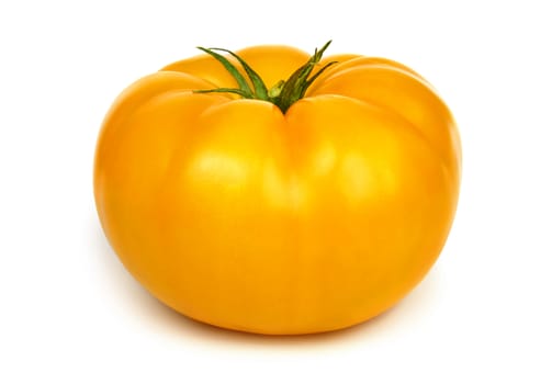 Big fresh yellow tomato isolated on white background.