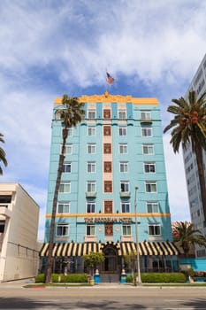 Santa Monica, California, March 28, 2016: Blue sky over The Georgian Hotel along the Pacific Coast Highway. Built in 1933, it hosted gangster Bugsy Siegel and actor Clark Gable. Editorial use only.