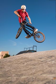 High BMX jump in a skate park.