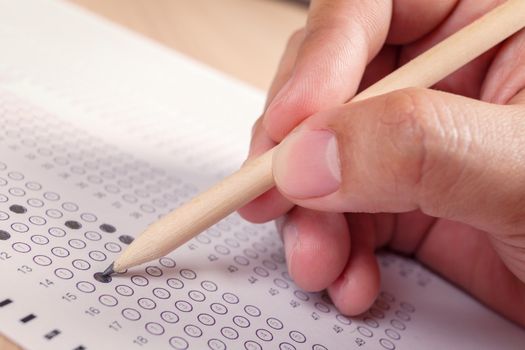 hand fill in Exam carbon paper computer sheet and pencil