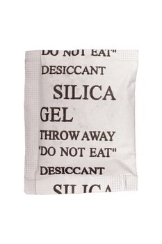 Close up silica gel or desiccant in paper bag on white background