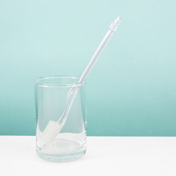 The clear toothbrush with small glass for brushing the teeth.