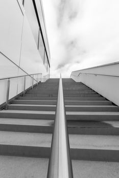 Steps with Railing by Building in black and white.