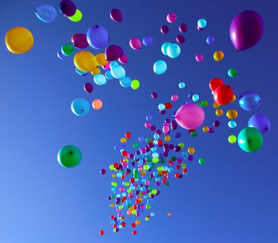 colorful balloons on a blue sky background