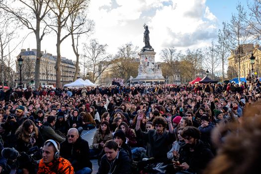FRANCE, Paris: Militants of the Nuit debout (Standing night) movement vote as thousand gather on April 7, 2016 at the Place de la Republique in Paris, as participants plan to spend the night camped out to protest against the government's planned labour reform and against forced evictions. It has been one week that hundred of people have occupied the square to show, at first, their opposition to the labour reforms in the wake of the nationwide demonstration which took place on March 31, 2016.