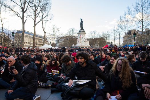 FRANCE, Paris: Militants of the Nuit debout (Standing night) movement gather on April 7, 2016 at the Place de la Republique in Paris, as participants plan to spend the night camped out to protest against the government's planned labour reform and against forced evictions. It has been one week that hundred of people have occupied the square to show, at first, their opposition to the labour reforms in the wake of the nationwide demonstration which took place on March 31, 2016.