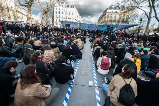 FRANCE, Paris: Thousand militants of the Nuit debout (Standing night) movement gather on April 7, 2016 at the Place de la Republique in Paris, as participants plan to spend the night camped out to protest against the government's planned labour reform and against forced evictions. It has been one week that hundred of people have occupied the square to show, at first, their opposition to the labour reforms in the wake of the nationwide demonstration which took place on March 31, 2016.