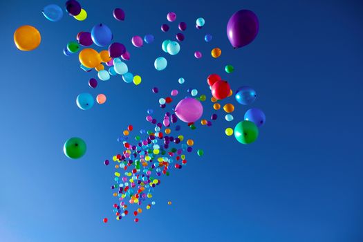 colorful balloons on a blue sky background