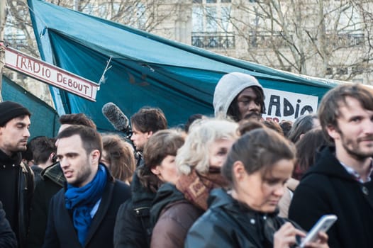 FRANCE, Paris: Thousand militants of the Nuit debout (Standing night) movement gather on April 7, 2016 at the Place de la Republique in Paris, as participants plan to spend the night camped out to protest against the government's planned labour reform and against forced evictions. It has been one week that hundred of people have occupied the square to show, at first, their opposition to the labour reforms in the wake of the nationwide demonstration which took place on March 31, 2016.