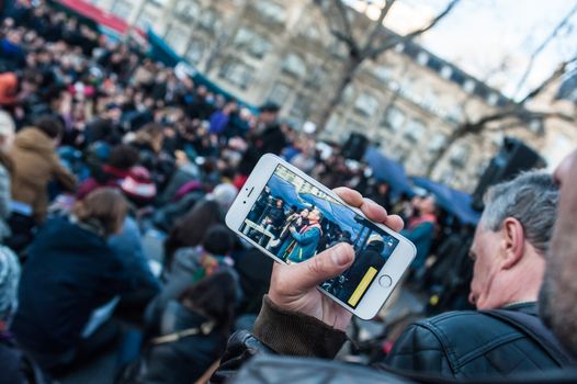 FRANCE, Paris: Thousand militants of the Nuit debout (Standing night) movement gather on April 7, 2016 at the Place de la Republique in Paris, as participants plan to spend the night camped out to protest against the government's planned labour reform and against forced evictions. It has been one week that hundred of people have occupied the square to show, at first, their opposition to the labour reforms in the wake of the nationwide demonstration which took place on March 31, 2016.