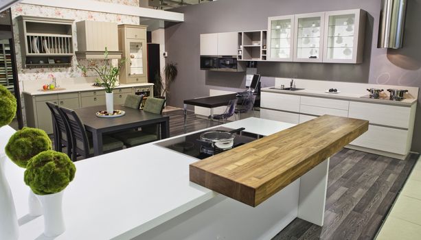 Luxurious kitchen with stainless steel appliances with fruit on the table