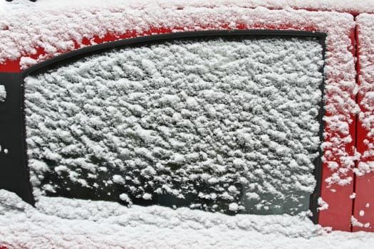 red car under the snow in denmark