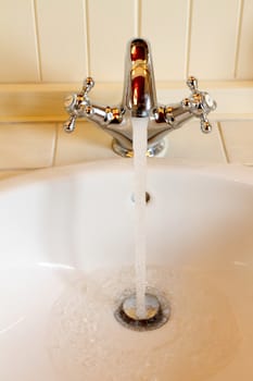 the current water from the mixer in a sink