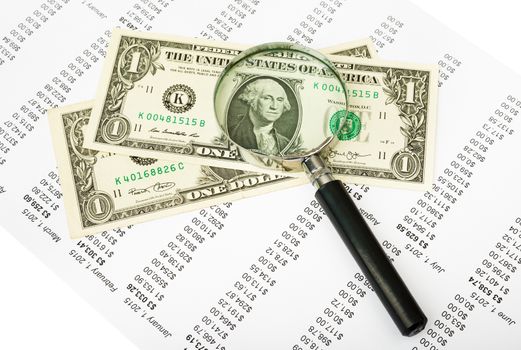 CAsh with magnifier on paper bill background, business concept