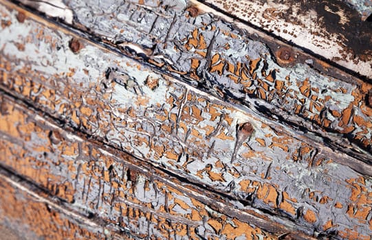 Close-up of an old abandoned boat with peeling paint