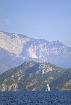 Yachting in Turkey - view of yachts and mountains from the sea