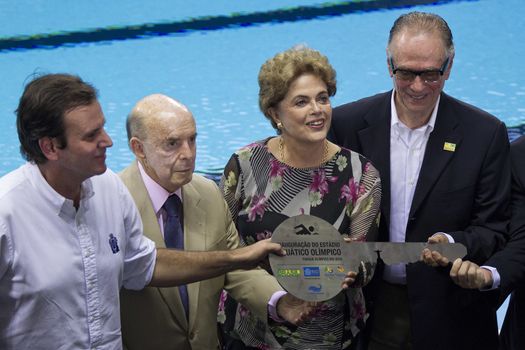 BRAZIL, Rio de Janeiro: Officials introduce the Olympic Aquatics Stadium in Rio de Janeiro, Brazil on April 8, 2016. From left: Rio de Janeiro Mayor  Eduardo Paes; Deputy Governor Francisco Dornelles; President Dilma Rousseff; and lawyer Carlos Nuzman.The venue, which will host events during the 2016 Olympics in Rio, has been built with sustainable 'nomadic architecture' that will allow it to be broken down, relocated, and reassembled into two smaller arenas.