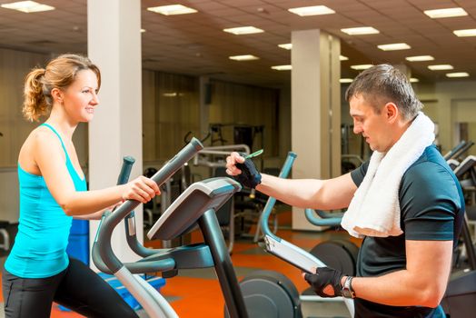 Trainer writes the result to the athletes training in the gym