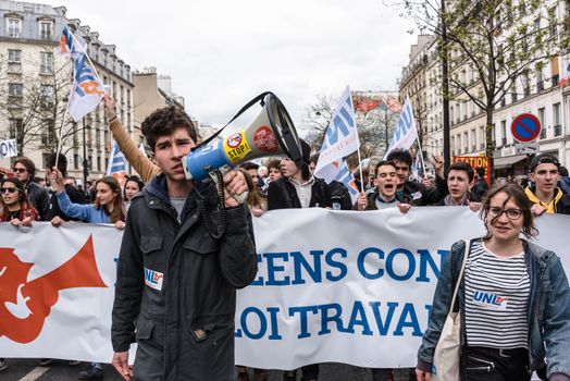 FRANCE, Paris: A demonstrator speaks into a loudspeaker during a protest on April 9, 2016 in Paris, against the French government's proposed labour law reforms.