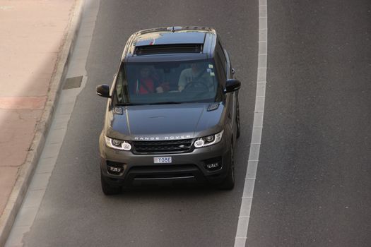 Monte-Carlo, Monaco - April 6, 2016: Aerial view of a Land Rover Range Rover Sport SUV in the Streets of Monaco. Man Driving a Black Range Rover Sport in the South of France