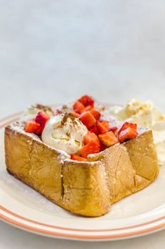 Strawberry honey toast with ice cream and whipped cream