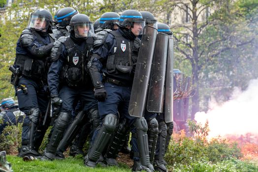 FRANCE, Paris: Riot policemen gather to face violent protesters during a demo on April 9, 2016 in Paris, against the French government's proposed labour law reforms.