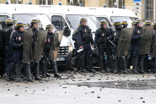 FRANCE, Paris: Riot policemen stand in line during a demo on April 9, 2016 in Paris, against the French government's proposed labour law reforms.