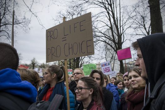 POLAND, Warsaw: People attend an anti-government and pro-abortion demonstration in front of parliament, on April 9, 2016 in Warsaw. The banner reads 'Pro life = pro choice'. 