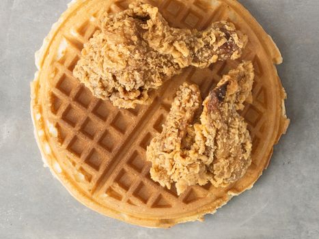 close up of rustic southern american comfort food chicken waffle