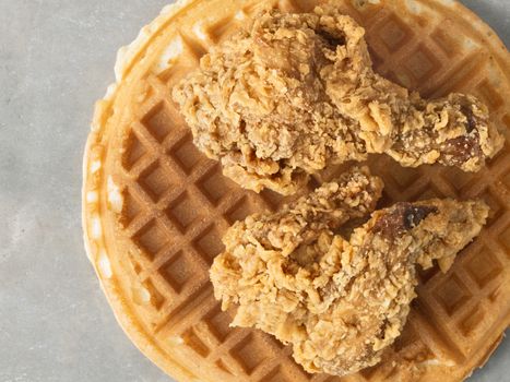 close up of rustic southern american comfort food chicken waffle