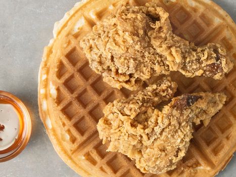 close up of rustic southern american comfort food chicken waffle