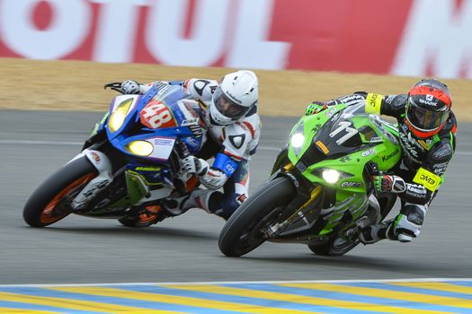 FRANCE, Le Mans: French 11 Kawasaki SRC team pilot (R) is pictured next  during the 39th edition of le Mans 24 hours moto endurance race on April 10, 2014 in Le Mans, western France. French team Leblanc-Lagrive-Foret on Kawasaki N.11 won the race.
