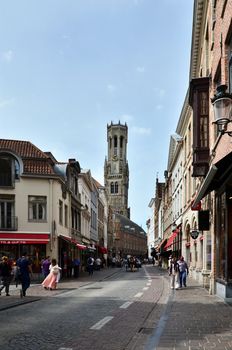 Bruges, Belgium - May 11, 2015: People walking in Bruges city on May 11, 2015. The historic city centre is a prominent World Heritage Site of UNESCO.