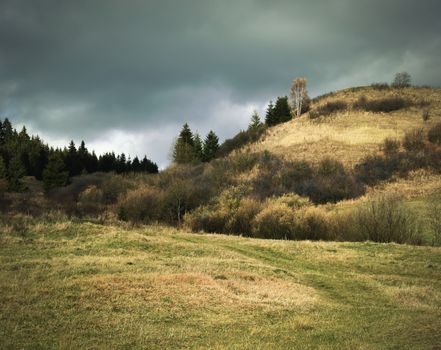 grim autumn landscape with overcast skies for rain