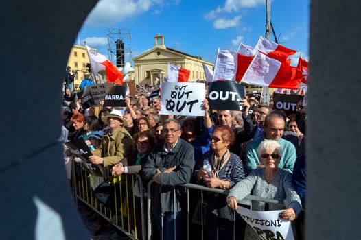 MALTA, Valletta: Protestors hold signs reading Out during a demonstration calling on Maltese Prime minister Joseph Muscat to resign after two members of his government were named in the Panama Papers leak scandal, outside the office of the Prime minister in Valletta, in Malta, on April 10, 2016. 