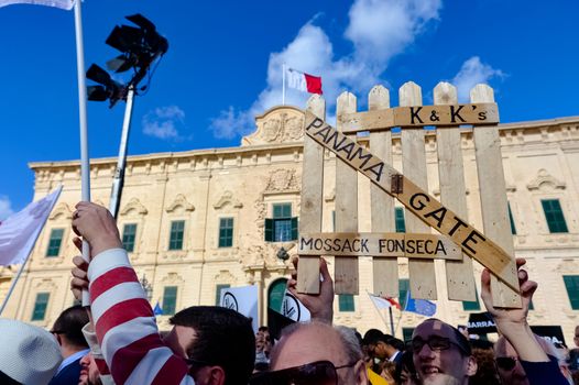 MALTA, Valletta: A protestor holds a sign reading Panama Gate during a demonstration calling on Maltese Prime minister Joseph Muscat to resign after two members of his government were named in the Panama Papers leak scandal, outside the office of the Prime minister in Valletta, in Malta, on April 10, 2016. 