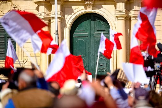 MALTA, Valletta: Protestors wave Maltese flags during a demonstration calling on Maltese Prime minister Joseph Muscat to resign after two members of his government were named in the Panama Papers leak scandal, outside the office of the Prime minister in Valletta, in Malta, on April 10, 2016. 