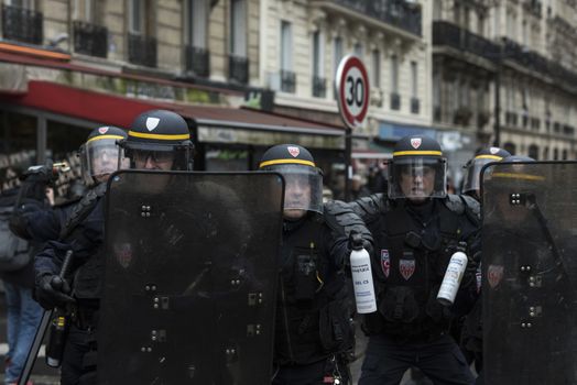 RANCE, Paris: Riot policemen hold tear gas bombs during a demonstration against labour reform in Paris on April 9, 2016.