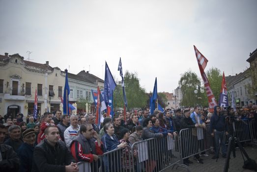 SERBIA, Vrsac: Supporters of former Serbian deputy PM Vojislav Seselj (C), who was trialed by the Hague Tribunal, wave flags at a rally in Vrsac on April 10, 2016, as part of his election campaign in Serbia. Elections which will be held in two-week. Throughout the 2016 election campaign, Seselj has visited many small cities around Serbia, including Vrsac, where 500 people attended the public rally.At this rally, Seselj yet again praised the Chetniks and Russia, while he criticized NATO, the EU and Serbia's pro-western orientation, as well as the current and former authority.