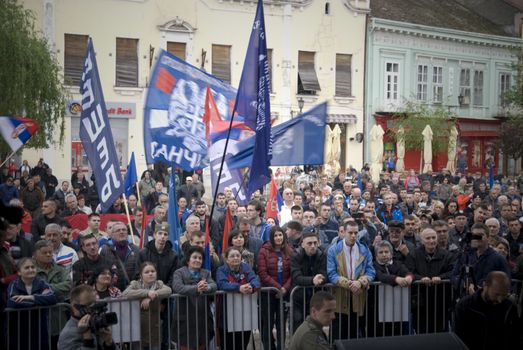 SERBIA, Vrsac: Supporters of former Serbian deputy PM Vojislav Seselj (C), who was trialed by the Hague Tribunal, wave flags at a rally in Vrsac on April 10, 2016, as part of his election campaign in Serbia. Elections which will be held in two-week. Throughout the 2016 election campaign, Seselj has visited many small cities around Serbia, including Vrsac, where 500 people attended the public rally.At this rally, Seselj yet again praised the Chetniks and Russia, while he criticized NATO, the EU and Serbia's pro-western orientation, as well as the current and former authority.