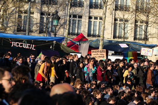 FRANCE, Paris: Thousand militants of the Nuit debout (Night Rising) movement gather on April 10, 2016 at the Place de la Republique in Paris, as participants plan to spend the night camped out to protest against the government's planned labour reform and against forced evictions. It has been one week that hundred of people have occupied the square to show, at first, their opposition to the labour reforms in the wake of the nationwide demonstration which took place on March 31, 2016.