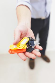 A man giving keys, vintage tone image .