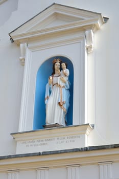 Statue of virgin Mary on catholic church facade