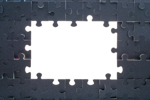 Grey puzzle background with big empty white space, close up view