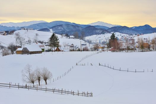 Winter romanian village and  mountain landscape