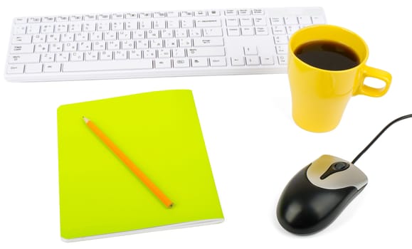 Cup of coffee with keyboard, mouse and notebook on isolated white background, closeup