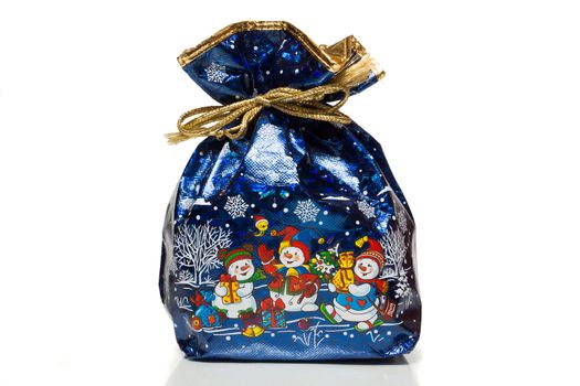 The photo depicts a bag with gifts