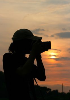 silhouette of photographer taking picture